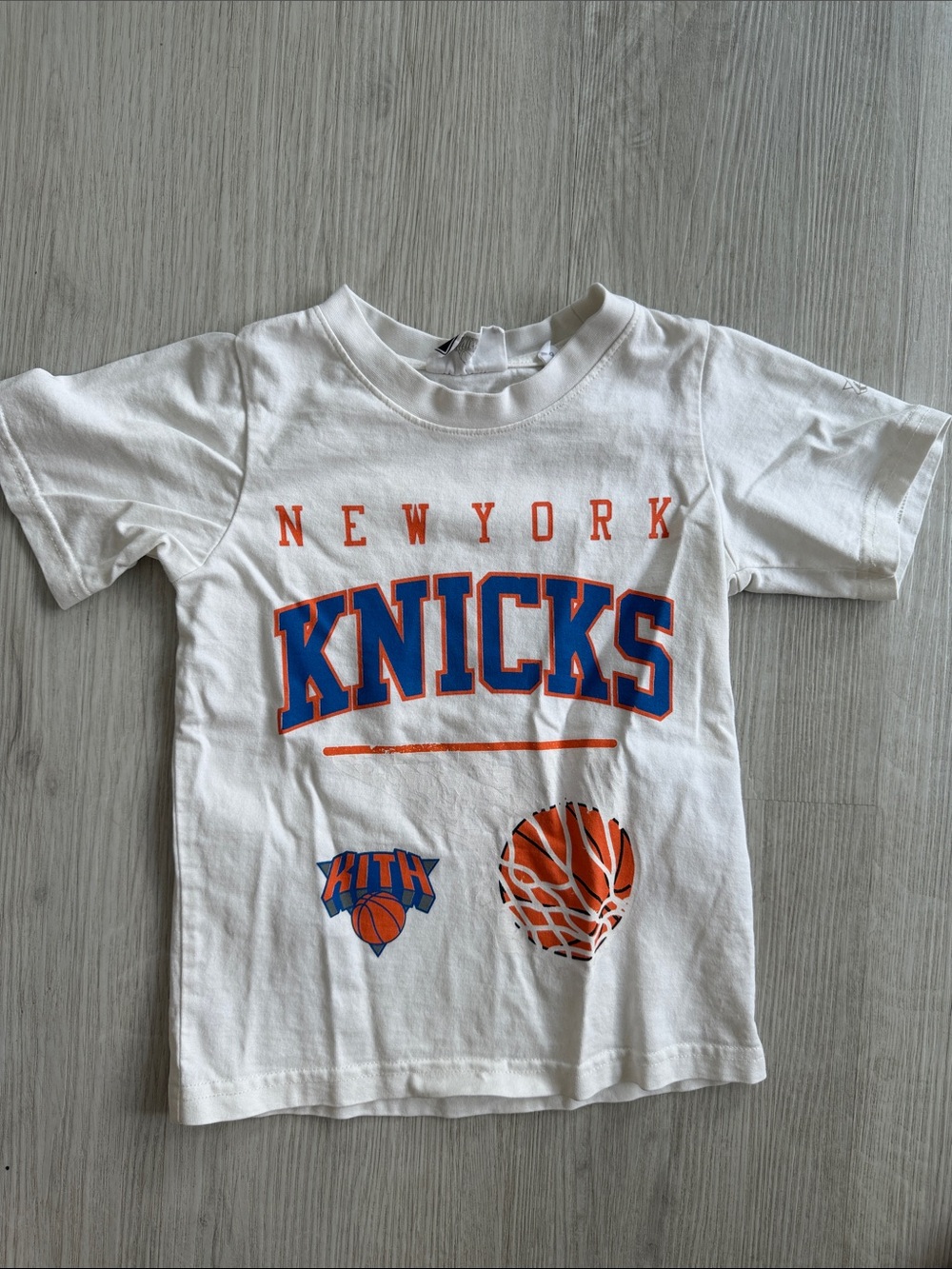 Kith White New York Knicks Graphic Tee with Blue & Orange Print